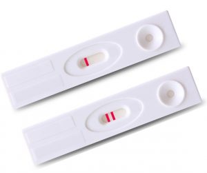 Positive and negative pregnancy tests isolated on white